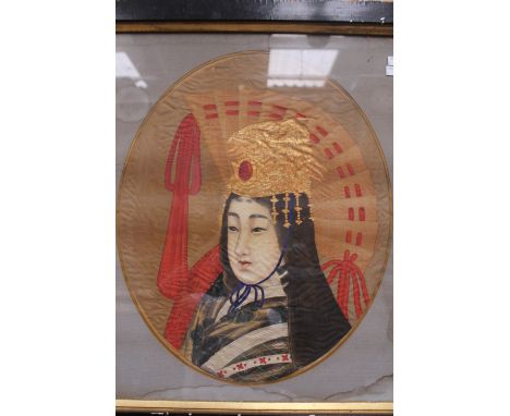 A 19th Century Japanese oval portrait of a lady wearing an ornate head dress, painted on silk 