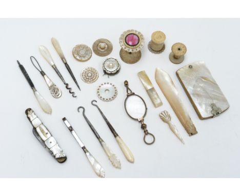 A collection of assorted mother of pearl items, comprising ivory notebook, part manicure set, reel holders, fruit knife, Long