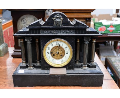 A black slate architectural mantel clock.