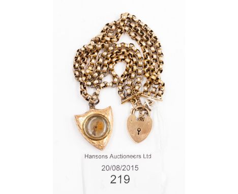 A 9ct yellow gold bracelet with padlock clasp, gold shield shape compass and three strand curb link.