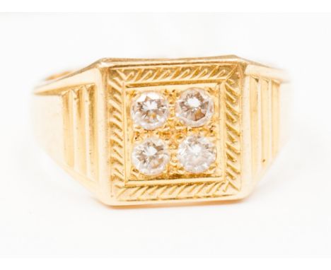 An 18ct gold, four stone diamond ring