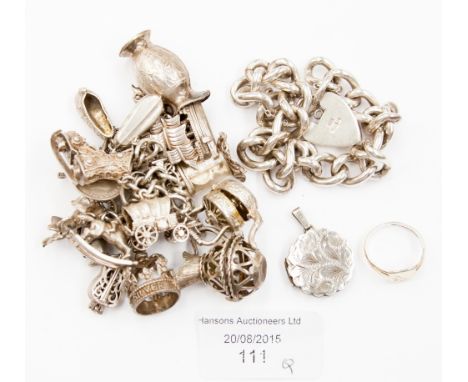 A silver gentlemen's fob bracelet, Birmingham 1979, plus a silver charm bracelet, a silver locket and a signet ring, total we