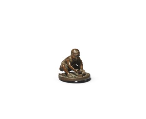 OUCHI GYOKUSO (1879-1944) OF TOKYOA Wood Netsuke of a Carpenter Taisho (1912-1926) or Showa (1926-1989) era, 20th centuryThe 
