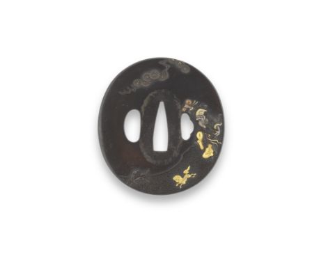 AFTER IWAMA MASAYOSHIEdo period (1615-1868) or Meiji era (1868-1912), 19th centuryA tsuba, oval, two hitsuana, shakudo migaki