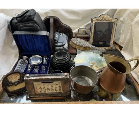 A sterling silver photograph frame together with a silver backed hair brush, silver calendar frame, bakelite calendar, shot g