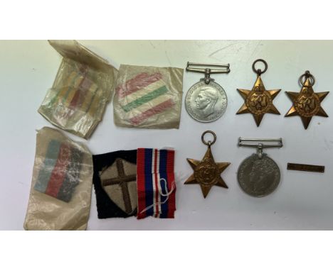 Five World War II medals including The Defence Medal, War Medal, The Africa Star, The Italy Star and The 1939-1945 Star, with