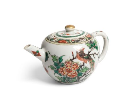 FAMILLE VERTE TEAPOT KANGXI PERIOD painted on one side of the bulbous body with a mighty phoenix perching on a twig above a f