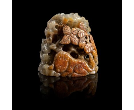 GREY AND RUSSET JADE 'TIGER' FINIAL MING DYNASTY carved and pierced in high relief on the russet-skinned side with a recumben