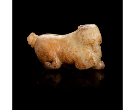 PALE CELADON AND RUSSET JADE CARVING OF A MYTHICAL ANIMAL MING DYNASTY carved seated with rear hind legs tucked beneath body,