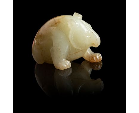 PALE CELADON JADE BEAR carved in seated pose with front paws supporting upper body, left front limb charged forward with body