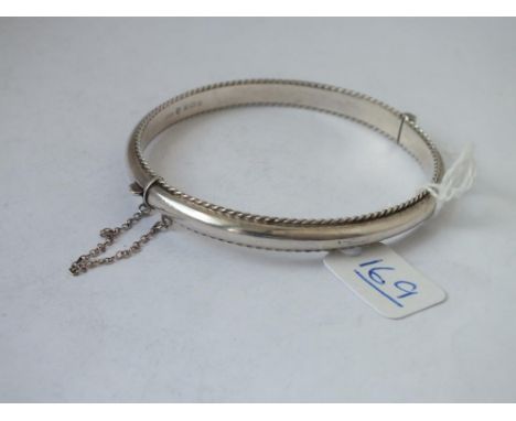 A hallmarked silver rope twist edged bangle