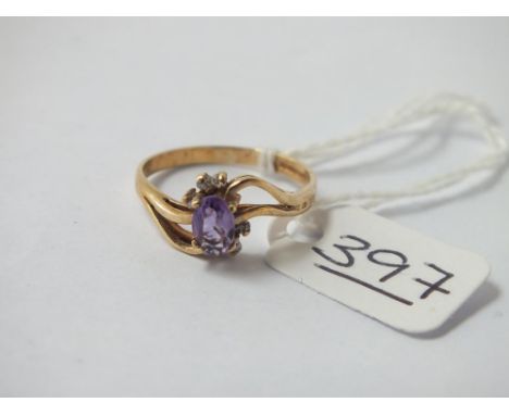 A amethyst &amp; diamond crossover ring set in 9ct - size O - 1.8gms