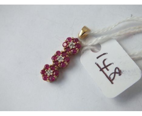 A ruby &amp; diamond triple cluster pendant 