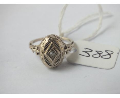 A diamond ring set in 14ct gold - size K - 2.5gms