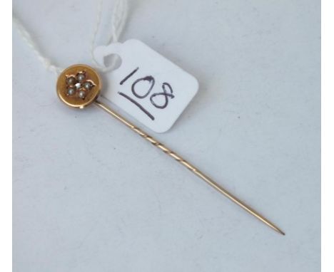 A pearl &amp; diamond topped stick pin in 15ct gold 