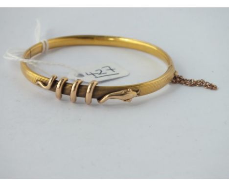 A bangle entwined with a snake in 15ct gold - 7.8gms