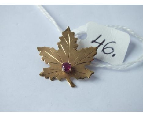 A ruby mounted leaf brooch set in gold - 1.8gms 