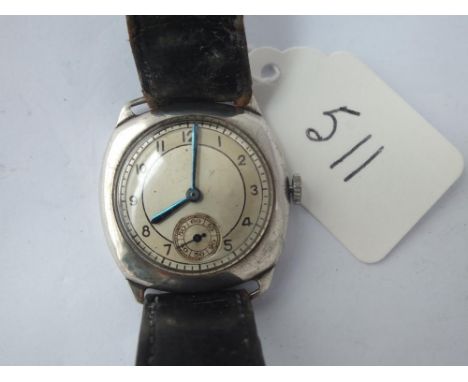 A silver vintage wrist watch with seconds sweep 