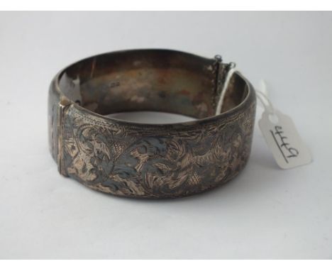 A wide silver bangle 