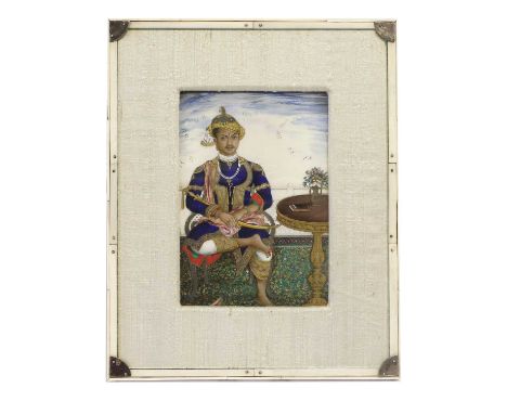 Indian School (2nd half 19th century): Miniature Portrait of a Rajah, sitting on a chair beside a tripod table holding a talw