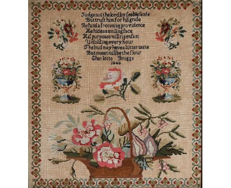 A Woolwork Verse Sampler, worked by Charlotte Briggs, dated 1849, worked in coloured wool cross-stitch depicting a central ve