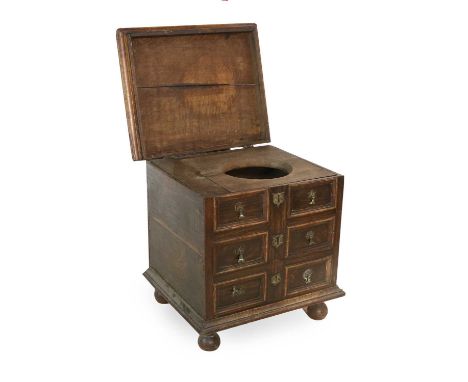 A George III Oak Close Stool/Commode, late 18th century, the hinged lid enclosing a removable seat and lidded compartment, wi