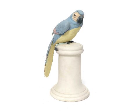 A Coloured Bisque Model of a Parrot, 1985, decorated in pastel hues and raised on a spreading socle, impressed marks R, KRK, 