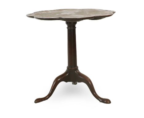 A Mahogany Tripod Table, the moulded top supported on a fixed platform with gun barrel tapering support on cabriole legs and 