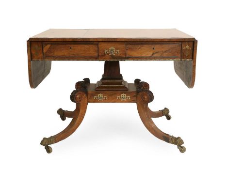 A Regency Rosewood and Brass-Inlaid Sofa Table, early 19th century, with two dropleaves, inlaid with brass stringing and fleu