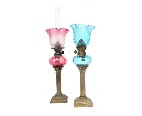A Victorian Peg Lamp, circa 1880, with cranberry tinted satin glass shade, cranberry reservoir and brass Corinthean column ba