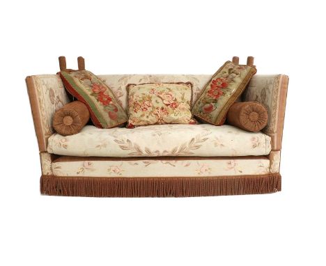 A Feather-Filled Knole-Style Sofa, 20th century, covered in faded cream and floral Aubusson-type fabric, the squab cushion ab