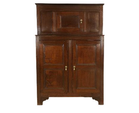A Mid 18th Century Joined Oak Cupboard, of attractive proportions, the upper section with a central cupboard door flanked by 