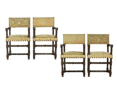 A Set of Four Cromwellian-Style Oak Open Armchairs, one pair covered in gold floral needlework close-nailed fabric, the other