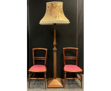 A mid 20th century walnut standard lamp, turned column, square base, 188cm tall (with shade);  a pair of Edwardian bedroom ch