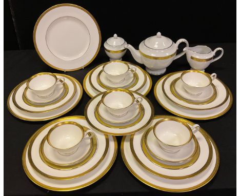 A Wedgewood Senator pattern dinner and part tea service for six, comprised of dinner plates, soup bowls, cups and saucers;  a