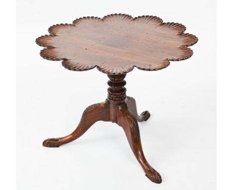 GEORGE III MAHOGANY PIECRUST TRIPOD TABLE
the top with shell lobes, on a foliate carved column, the legs with scroll blind ca