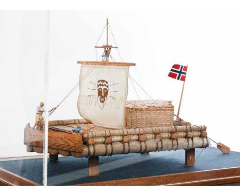 SCRATCHBUILT 1;40 SCALE MODEL OF THE KON-TIKI
on an inscribed mahogany plinth under a perspex case, 32cm high, 50cm long over