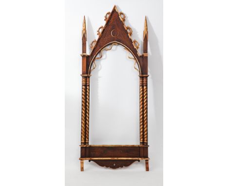 PAIR OF PARCEL GILT STAINED OAK GOTHIC REVIVAL ARCHITECTURAL PICTURE FRAMES
230cm high, 95cm wide
