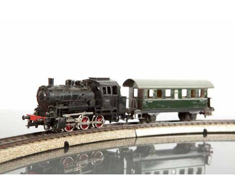 MARKLIN MODEL RAILWAY SET 
circa 1959, with a transformer, coaches, trucks, vans, tanker wagons, track, buffers, signal and p