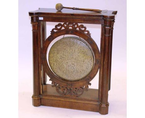VICTORIAN CARVED OAK CASED DINNER GONG
of architectural form with four columns, with original striker, 90cm high