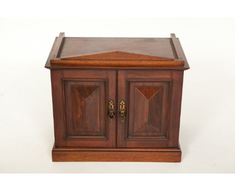 LATE VICTORIAN MAHOGANY TABLE COLLECTOR'S CABINET
of architectural form, the interior with eleven drawers having brass recess