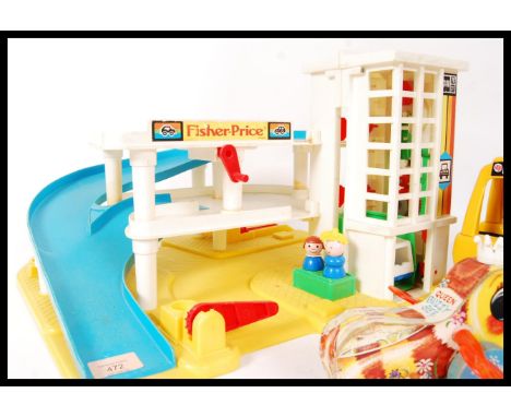 An assorted collection of vintage&nbsp;Fisher Price toys to include the garage play set , telephone and the Little Tikes coac