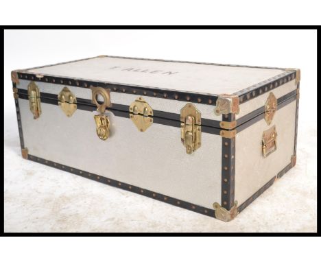 A vintage 20th Century chromed steamer trunk, polished finish,hinged top with latches and lock to front, carry handles to the