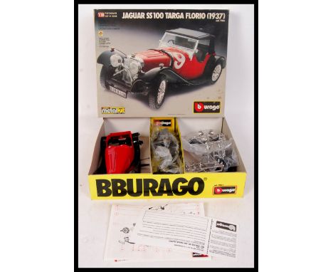 An original vintage Burago Jaguar SS 100 Targa Florio ( 1937 ) cod. 7006 model car kit. 1/18 scale contents appear unused and