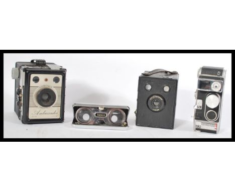 A group of vintage cameras to include a Bolex super 8 , Brownie and a Coronet along with a pair of Tasco opera glasses.