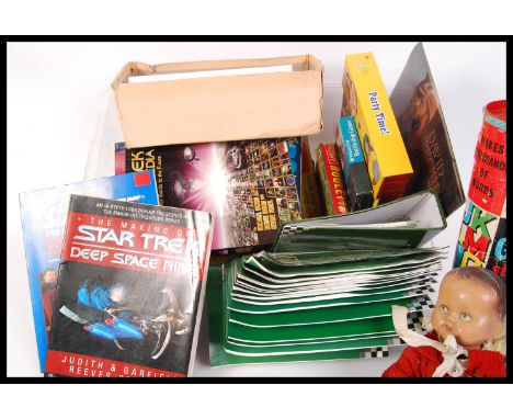 A collection of assorted various vintage toys , games , books and magazines to include a 1950's composition doll possibly mad