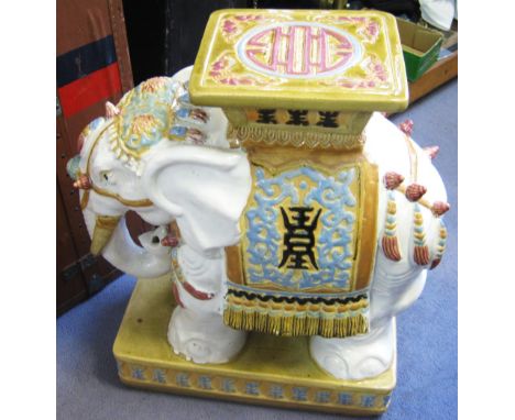 CERAMIC ELEPHANT SEAT, decorated in colours, 58cm H x 50cm nose to tail.