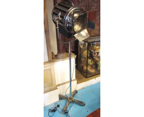 STUDIO/THEATRE LAMP, 20th century polished metal on castors, 183cm H. 