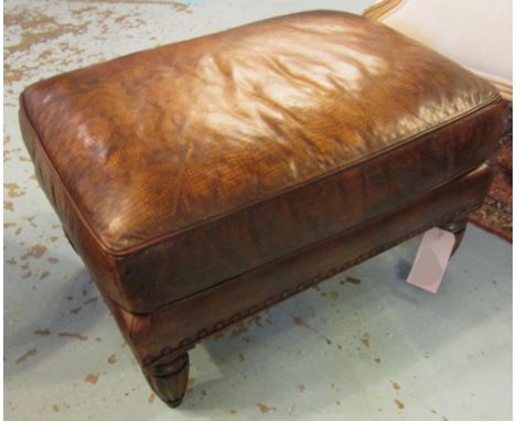HEARTH STOOL, rectangular tan hide leather and reeded tapering supports, a companion to previous lot, 76cm W x 55cm D. 