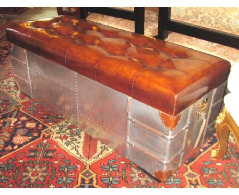AVIATOR STYLE TRUNK, aluminium and slatted with deep button upholstered rising lid, 120cm W x 44cm D x 45cm H. 